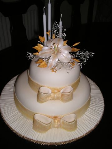 Photo Wedding Cake on Cake With Sugarpaste Bows Candles Royal Iced Wedding Cake Wedding Cake